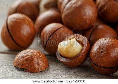 Macadamia Nut On A Wooden Table In A Bag, Closeup, Top View