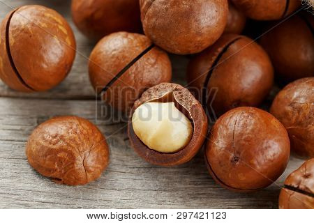 Macadamia Nut On A Wooden Table In A Bag, Closeup, Top View