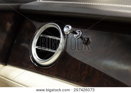A Close-up View Of A Part Of The Interior Of A Modern Luxury Car With A View Of The Ventilation Chro