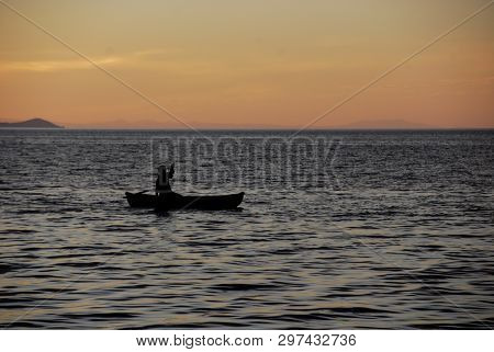Lake Malawi, Malawi, 4/3/07  A Man In A Canoe On Lake Malawi, Malawi