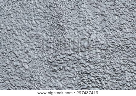 Abstract Raggy Silver Background. The Pattern Of Gray Shiny Cement Wall. Reflecting Uneven Texture W