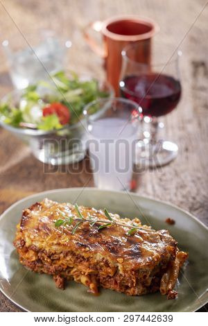 Greek Pastizio Noodle Dish With Cheese On Wood