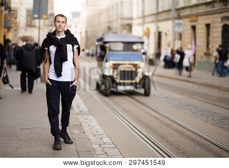 Young Traveler Man Walk Alone By Old Europen Street