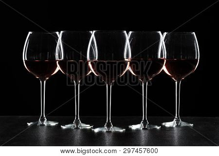 Glass Of Red, Rose And White Wine Over Black Background. Wine Card Menu Design. Closeup Of Wineglass