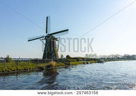 Waterways Of North Holland And View On Traditional Dutch Wind Mill, Spring Landscape