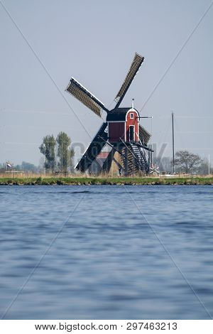 Waterways Of North Holland And View On Traditional Dutch Wind Mill, Spring Landscape