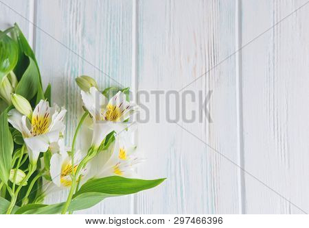 Frame For Greeting Card With Flowers. Banner With Natural Alstroemeria Flowers On A Wooden Backgroun