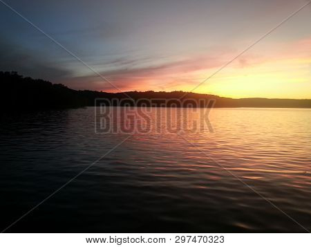 Sunrise/sunset On The Lake.  Calm Water And Colorful Sky.