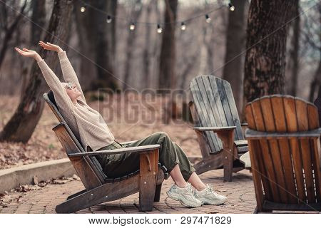 Woman Relaxing In The Forest On Weekeend