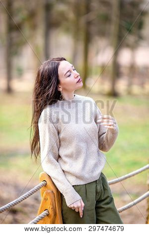 Woman Relaxing In The Forest On Weekeend