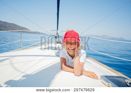 Little Boy Having Fun On Yacht On Summer Cruise. Travel Adventure, Yachting With Child On Family Vac
