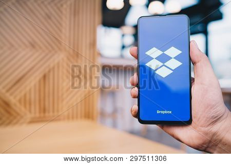 Chiang Mai, Thailand - Mar. 23,2019: Man Holding Xiaomi Mi Mix 3 With Dropbox On Screen.dropbox Is A