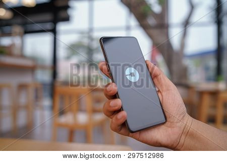Chiang Mai, Thailand - Mar. 23,2019: Man Holding Xiaomi Mi Mix 3 With Uber Apps. Uber Is Smartphone 