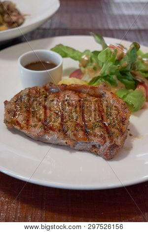 Barbecue Beef Steaks Medium Rare With Grilled Potaoes And Vegetables.
