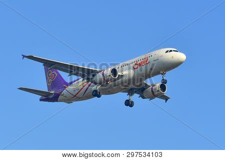 Passenger Airplane Landing At The Airport