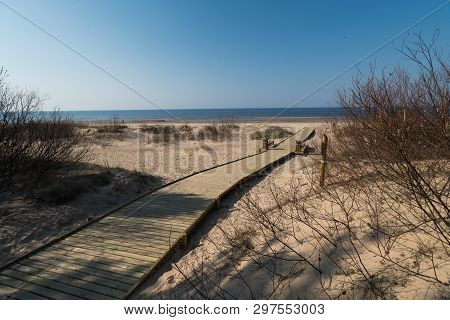 New Wooden Road Leading From The Beach Dune Forest With Pines And White Sent To The Baltic Sea Gulf 
