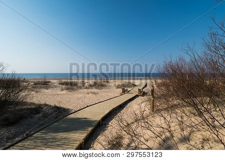 New Wooden Road Leading From The Beach Dune Forest With Pines And White Sent To The Baltic Sea Gulf 