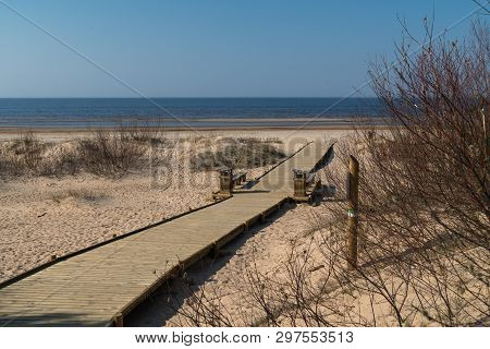 New Wooden Road Leading From The Beach Dune Forest With Pines And White Sent To The Baltic Sea Gulf 