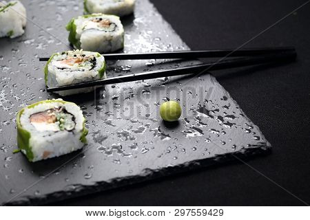 Sushi. Sushi Roll With Salmon, Cucumber, Cheese, Kampyo And Avocado Slices.
