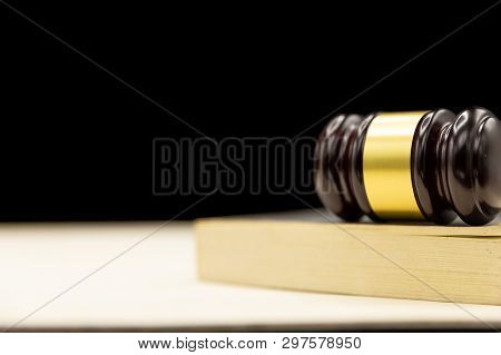 Judges Gavel On Book And Wooden Table. Law And Justice Concept Background.