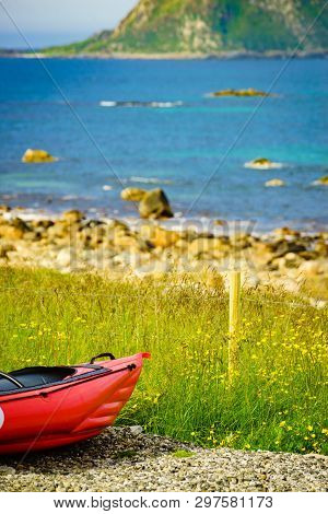 Seascape, Sea Coast With Red Canoe Kayak On Shore, Resort Bleik Andoya Norway. Vesteralen Archipelag