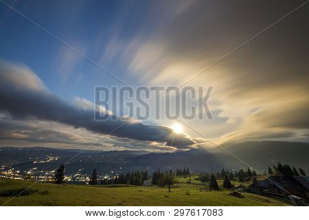 Summer Night Mountain Panorama. Green Grassy Mountain Clearing, Spruce Trees On Blue Evening Sky Cop