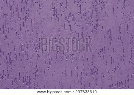 Purple Stucco With Embossed Backdrop On Concrete Wall. Abstract Violet Pattern On The Ribbed Wall. P