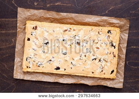 Traditional Polish Easter cake called Mazurek with plenty of dried fruits and nuts, top view