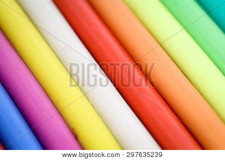 Colorful Children Play Dough Lies In A Row Next To Each Other