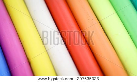 Colorful Children Play Dough Lies In A Row Next To Each Other