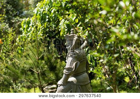 stone ruined Arhat statue in forest, Taiwan, Asia