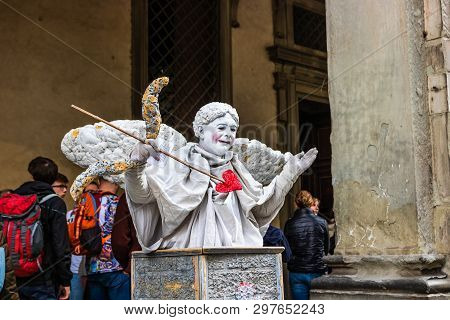 Florence, Italy - 2019. Street Performer As Cupidon In Florence Main Square.