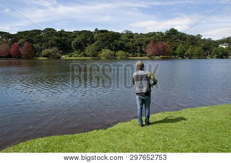 Flyfishing On The Lake In Brazil, Young Fisherman Fishing.