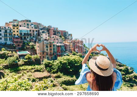 Happy Girl Making With Hands Heart Shape On The Old Coastal Village In Cinque Terre National Park. E