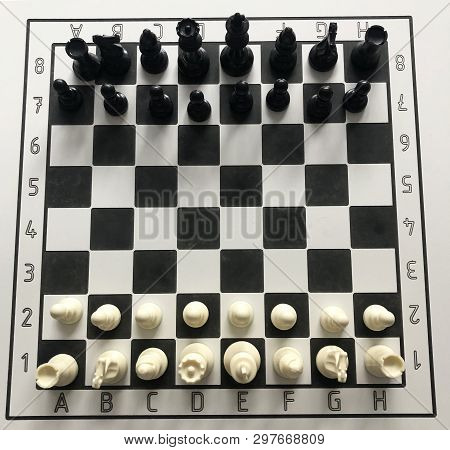 Starting Position Chess On The White And Black Table
