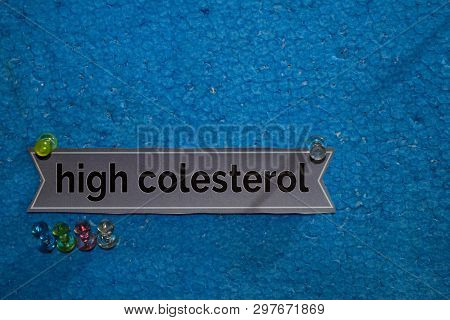 High Colesterol Text On The Paper Is Attached To The Styrofoam With Push Pins, Health Care Concept A