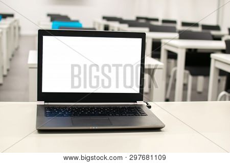 Laptop, Online Business, Teacher Work In The Classroom.laptop Put On A Table Or Desk Located In Empt