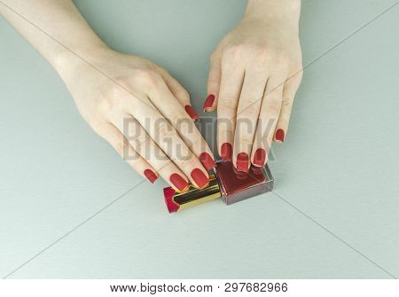 Stylish Fashionable Female Red Matte Manicure, Square Shape, On Black Background, Crocadile Skin
