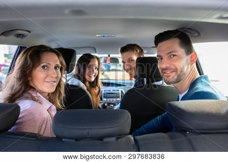 Smiling People Sitting Inside The Ride Sharing Car