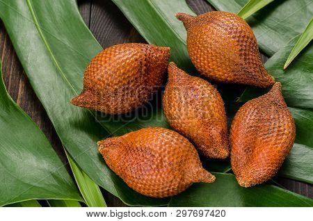 Snake Fruit, Rakum, Sala On Wood Background. Tropical Fruit.