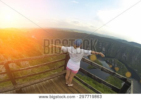 Woman On The Top Of The Hill And Panorama Of Canyon Uvac In Serbia. At Wooden Platform View Point