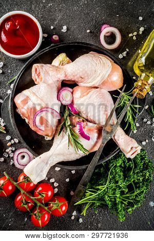 Raw Chicken Legs Ready For Cooking, With Fresh Vegetables, Herbs And Spices, Black Concrete Backgrou