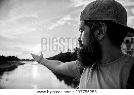 River Sun Reflection. Man In Cap Enjoy Sunset While Stand On Bridge. Enjoy Pleasant Moment. Guy In F