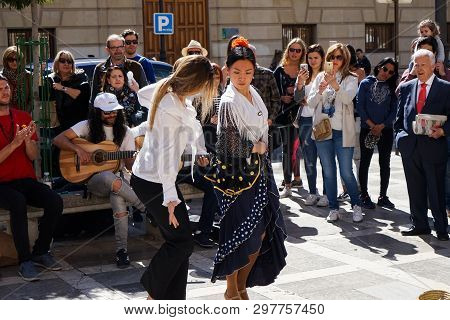 Granada, Spain 10Th March 2019: Flamenco Dancer Dances For Tourists In Plaza Nueva.