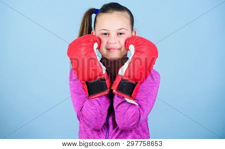 Contrary To Stereotype. Boxer Child In Boxing Gloves. Female Boxer. Sport Upbringing. Boxing Provide