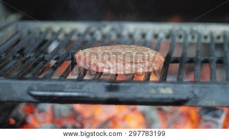 Cooking Hamburger. Beef Or Pork Cutlet Grilling On Grid.