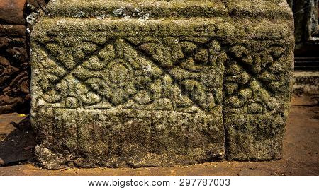 The Sculpture At The Base Of Sandstone Column In The Temple Of Pimai In Thailand.
