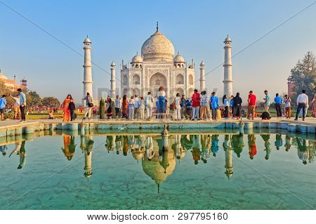 Agra, India - March 5 2018: Tourists Sighteseeing, Exploring And Admiring Famous The Taj Mahal