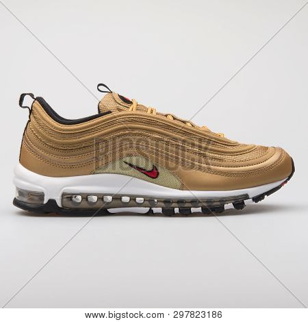 Vienna, Austria - August 7, 2017: Nike Air Max 97 Og Qs Gold Sneaker On White Background.