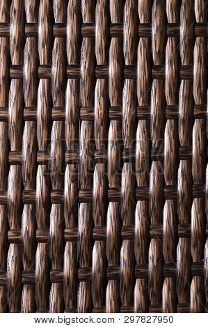 Close-up Dark Brown Background Is An Element Of Wicker Furniture Made Of Polymer Fibers. Synthetic L